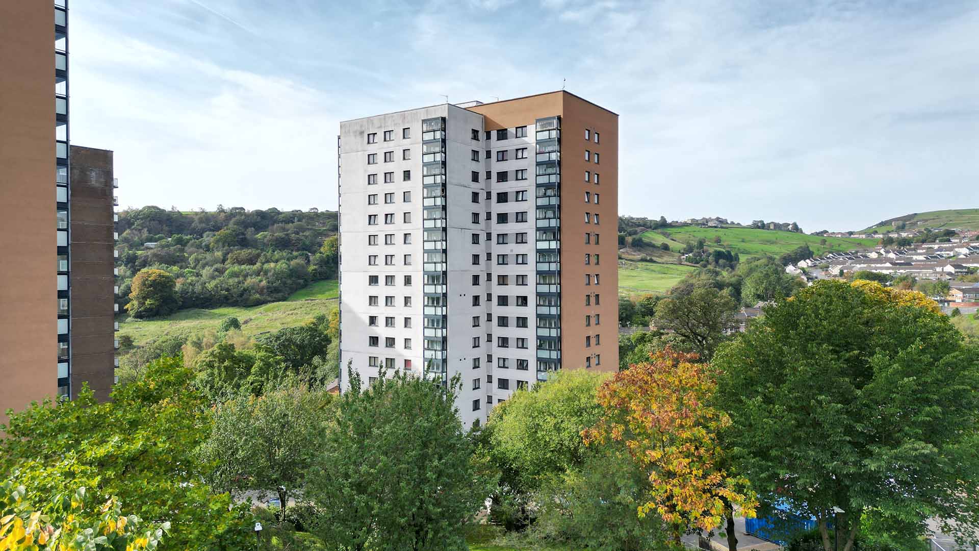 Jumples Flats surrounded by trees and blue sky